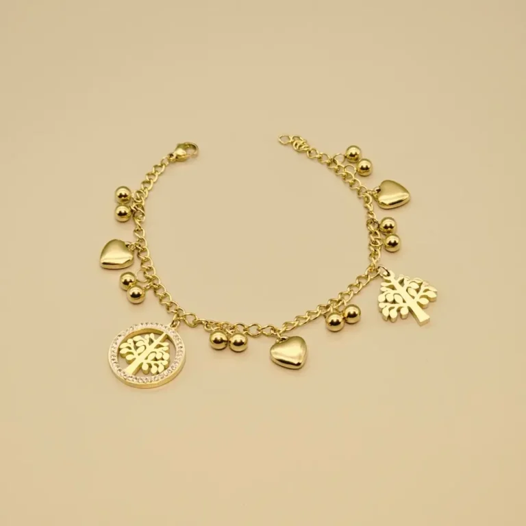 Gold charm bracelet with tree, hearts, beads