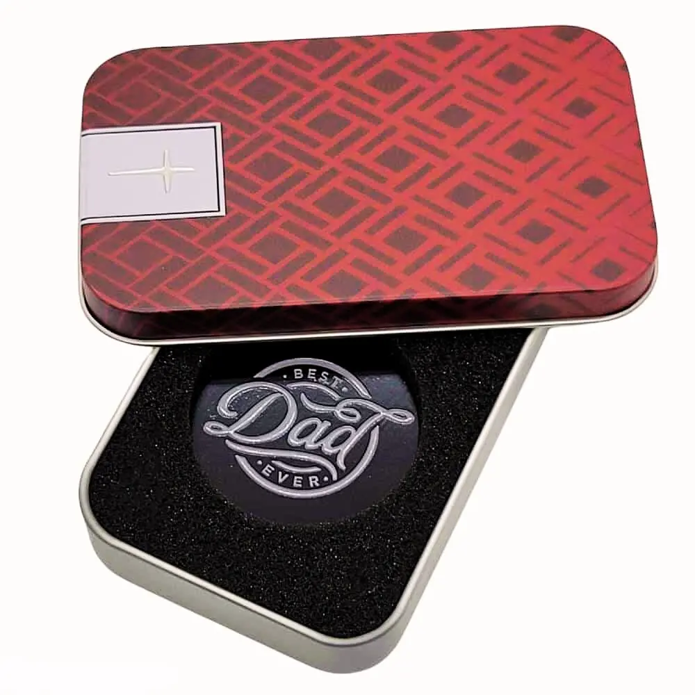 "Metal keyring in a high-quality tin box with black foam padding, engraved with 'Best Dad Ever,' displayed on a light gray background."