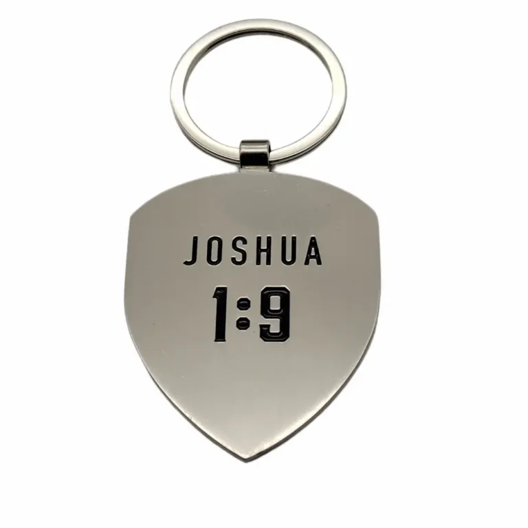 Silver keychain with "JOSHUA 1:9" engraving