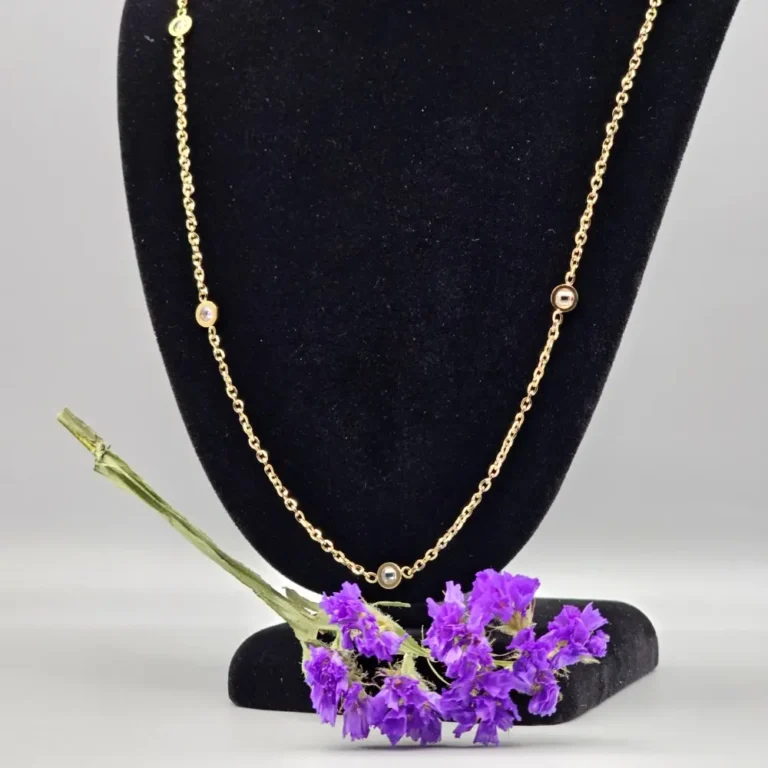 Gold necklace with gems, purple flowers