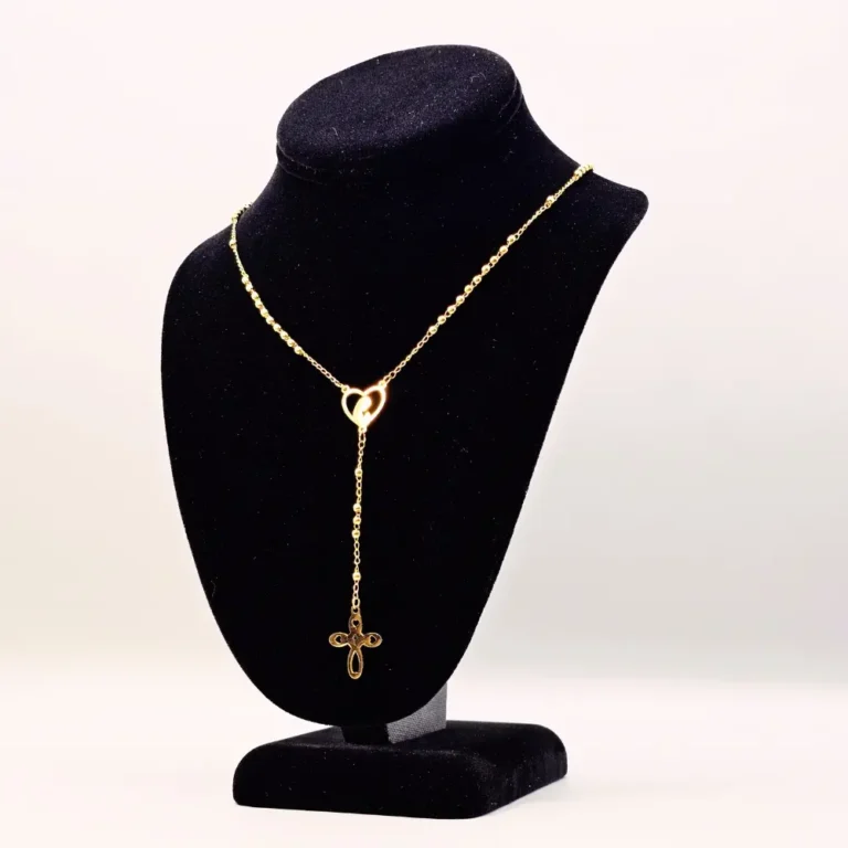 Gold necklace with gemstones on display