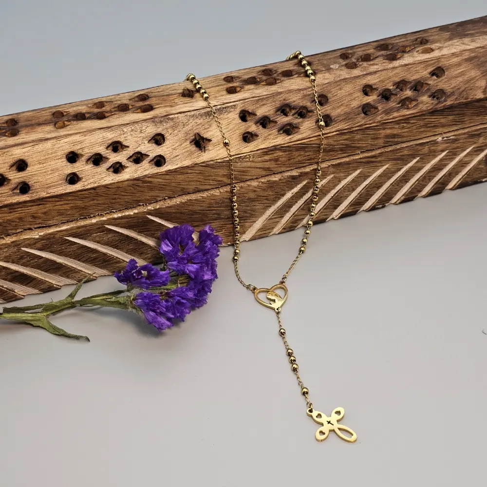 Gold necklace with heart, cross, purple flowers