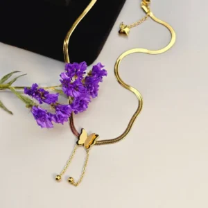 "Zirconia Butterfly Necklace displayed on a light gray background with a subtle violet flower."