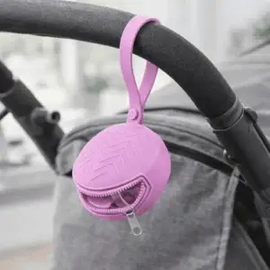Silicone pacifier holder attached to stroller handle with zipper and strap for baby